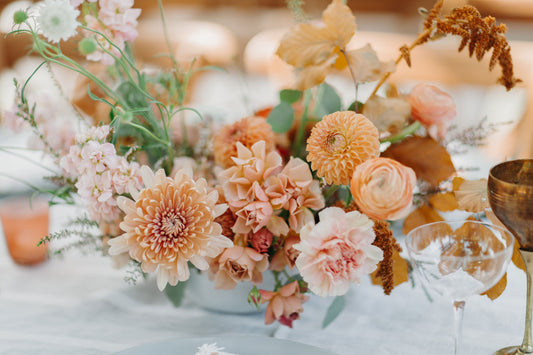 Peach, pink, and ivory wedding flower centerpiece