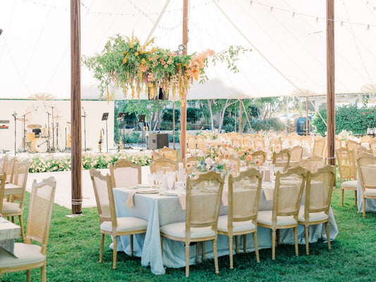 Pastel hanging floral install above wedding reception dance floor