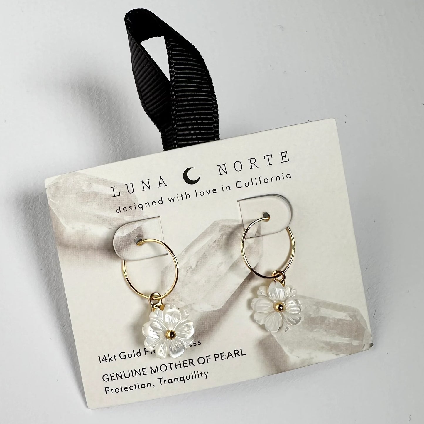 Blooming Mini Hoop Earring on a retail display card Luna Norte