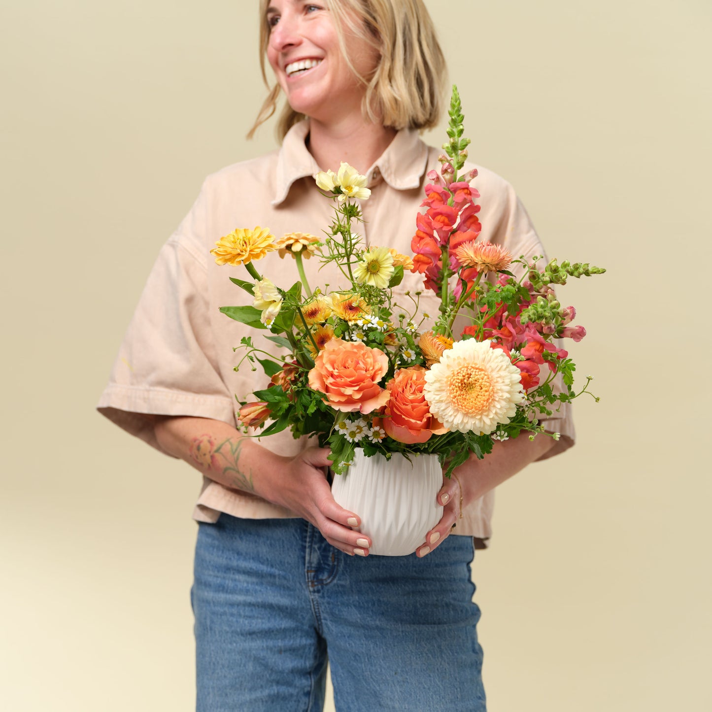 Natalie Gill holds Classic flower arrangement from Native Poppy