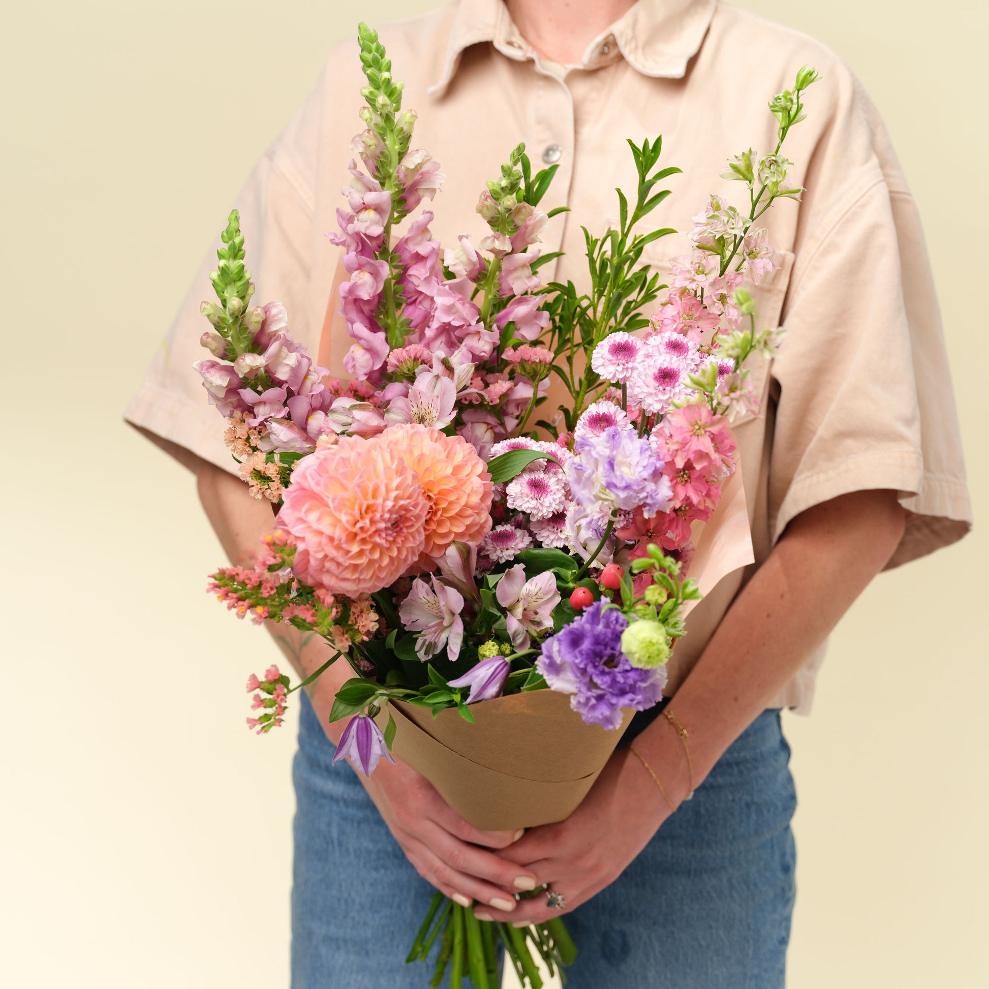 Woman holding Grand seasonal flower wrap from Native Poppy