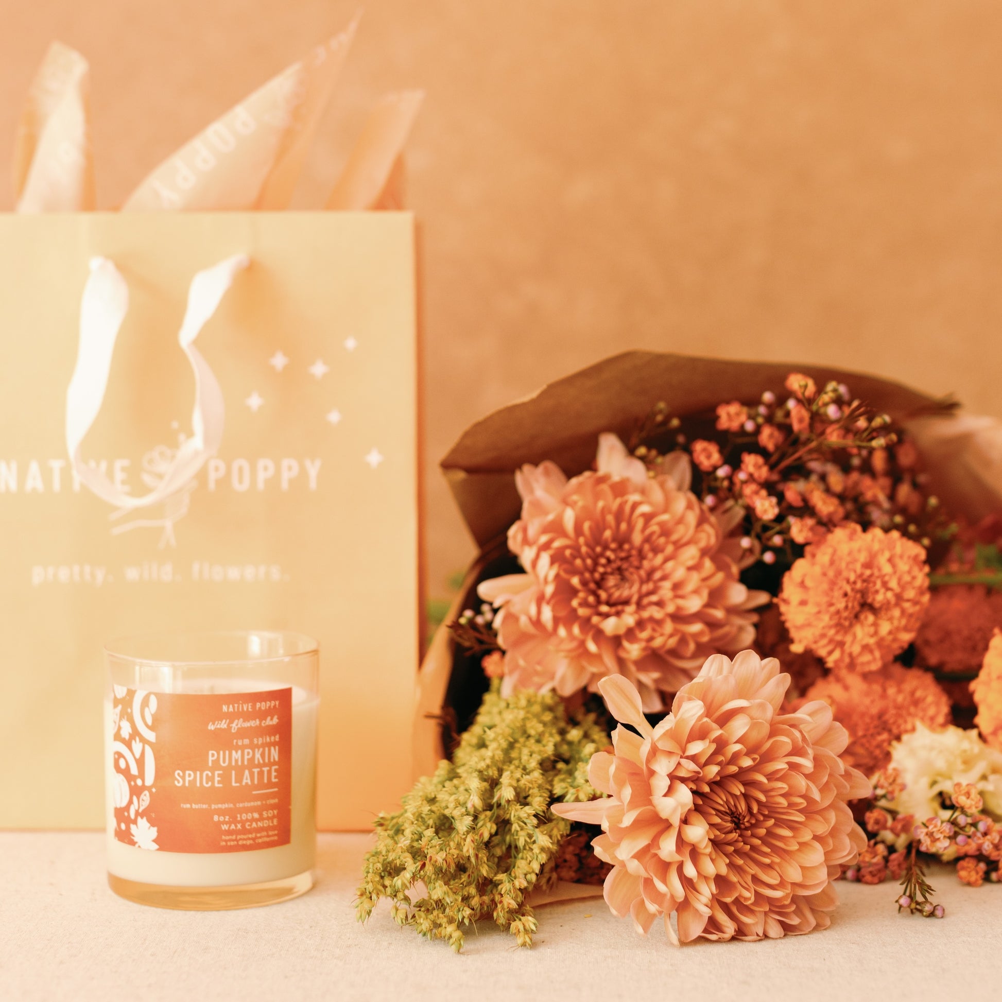 Gratitude Gift Bundle with a pumpkin spice candle and seasonal flower bouquet