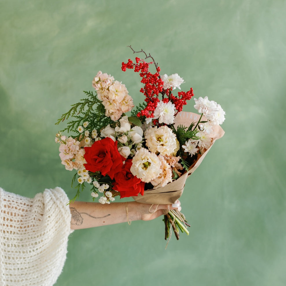 Red, green, pink, and white holiday flower wrap from San Diego Florist Native Poppy