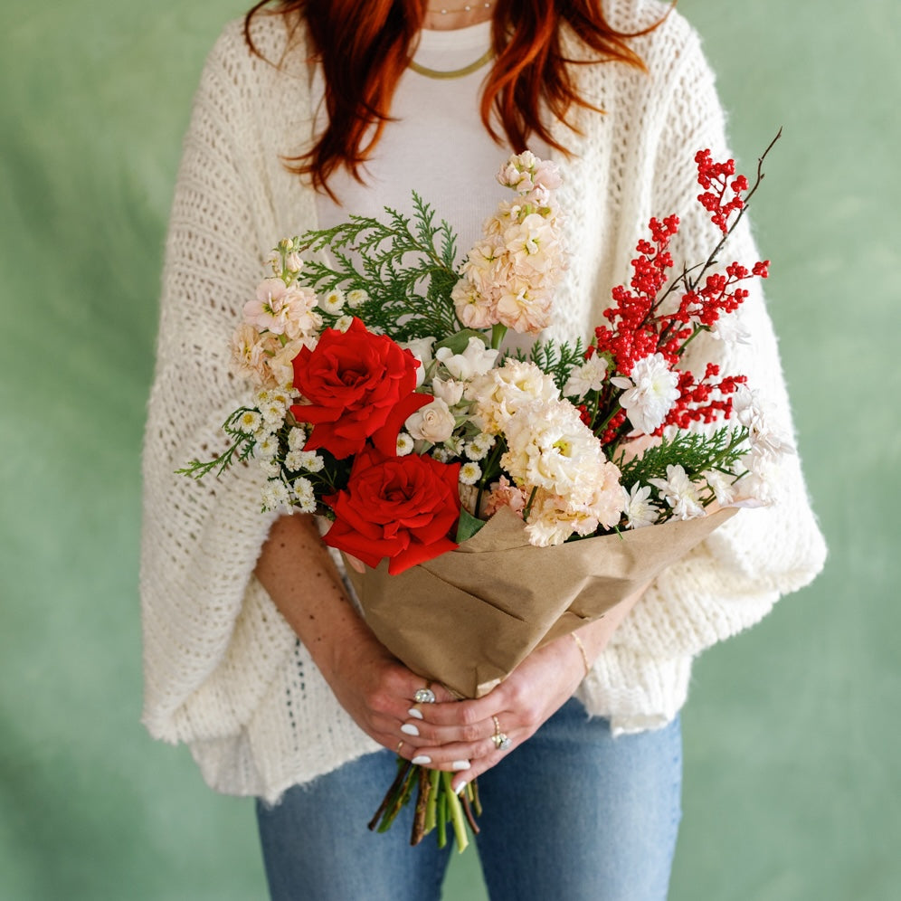 Meg holds "Poppy Holidays" bouquet from Native Poppy