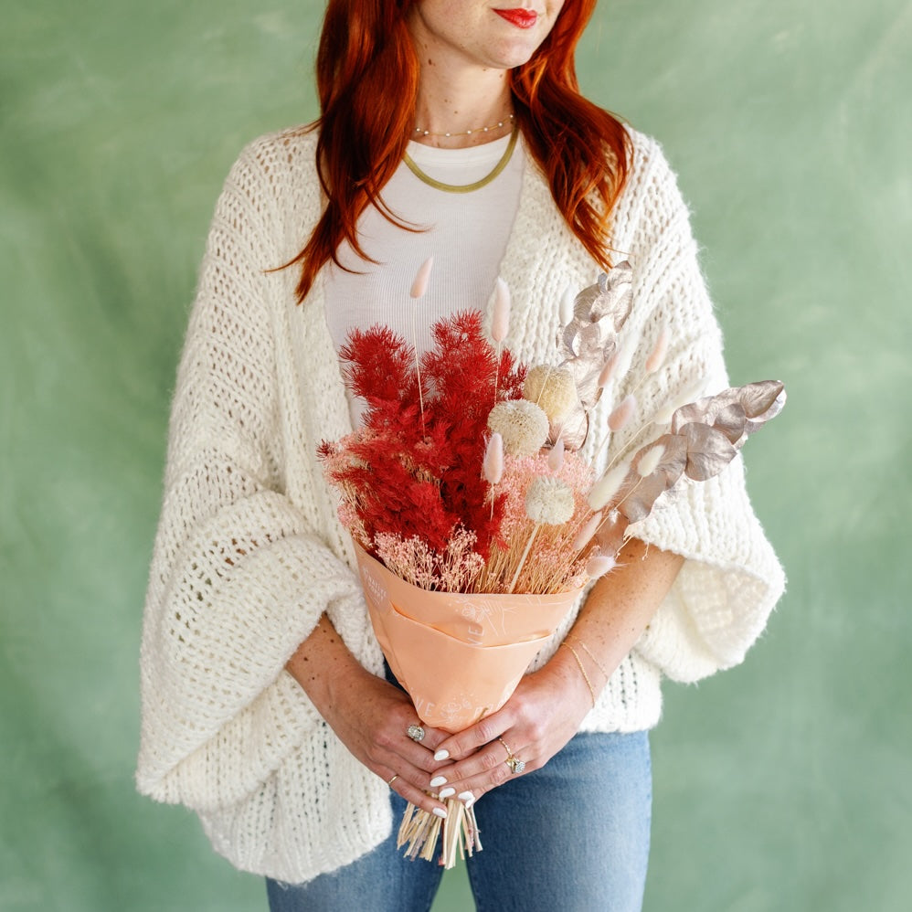 Meg Blancato holds Poppy Holidays Dried Flower Wrap