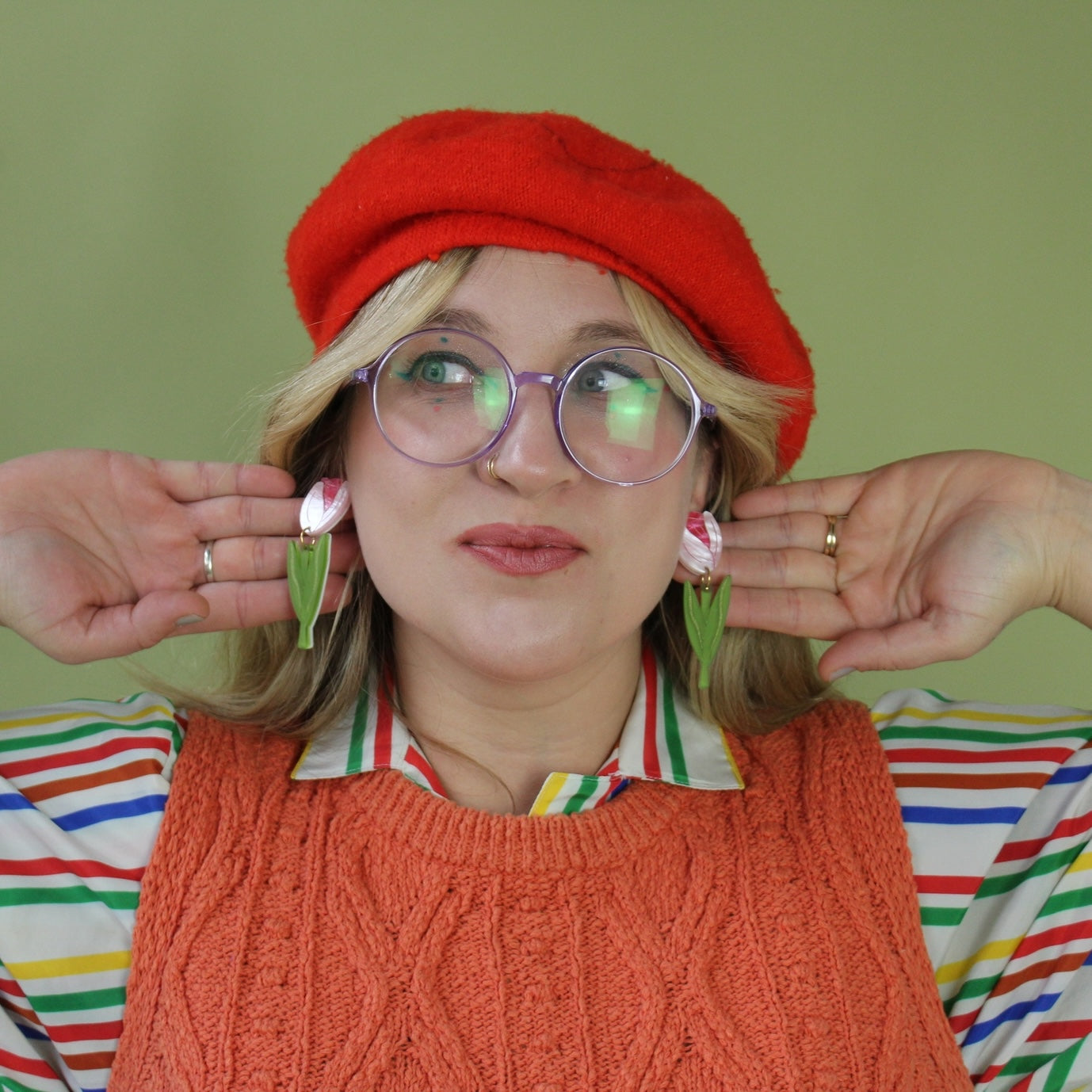 Woman wearing Tulip Acrylic Earrings and red beret hat