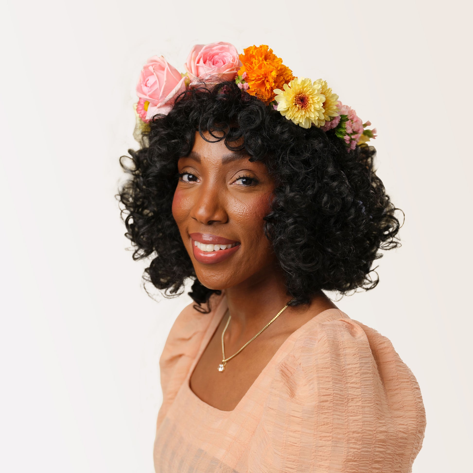 Flower Crown from San Diego florist Native Poppy - "The Frida" - woman wears large colorful flower crown