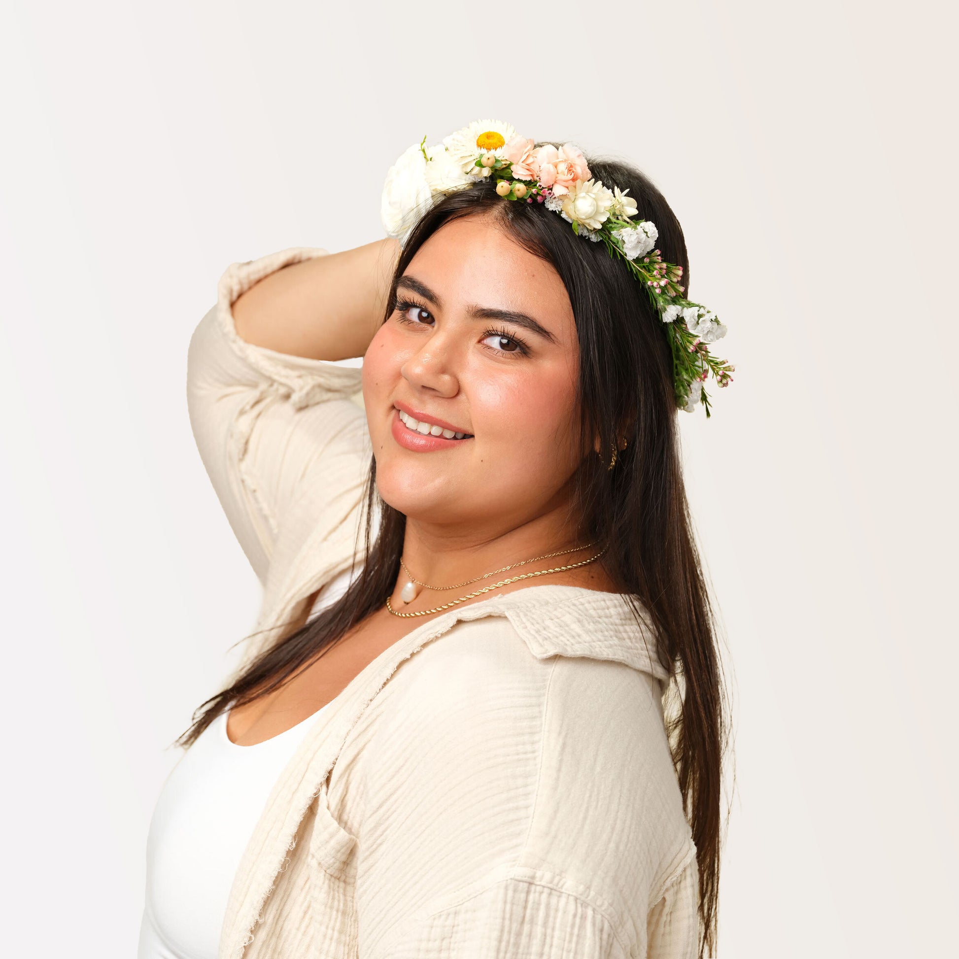 Woman wearing a Asymmetrical flower crown from Native Poppy in San Diego