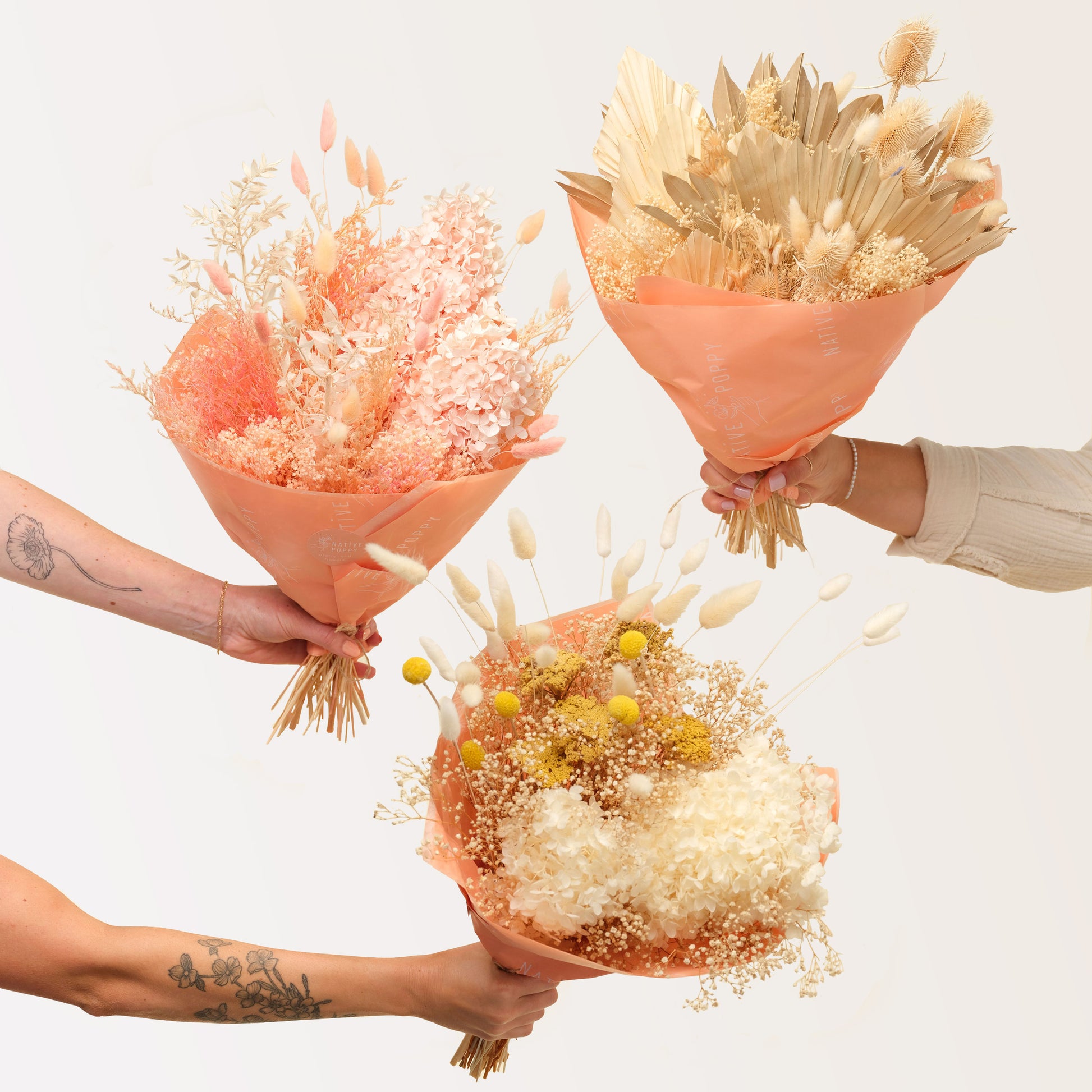 Dried Flowers in three styles wrapped in peach paper