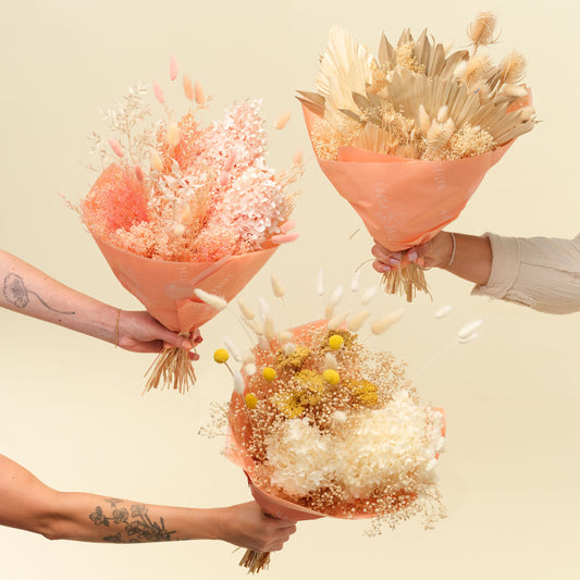 Dried Flowers in three styles wrapped in peach paper