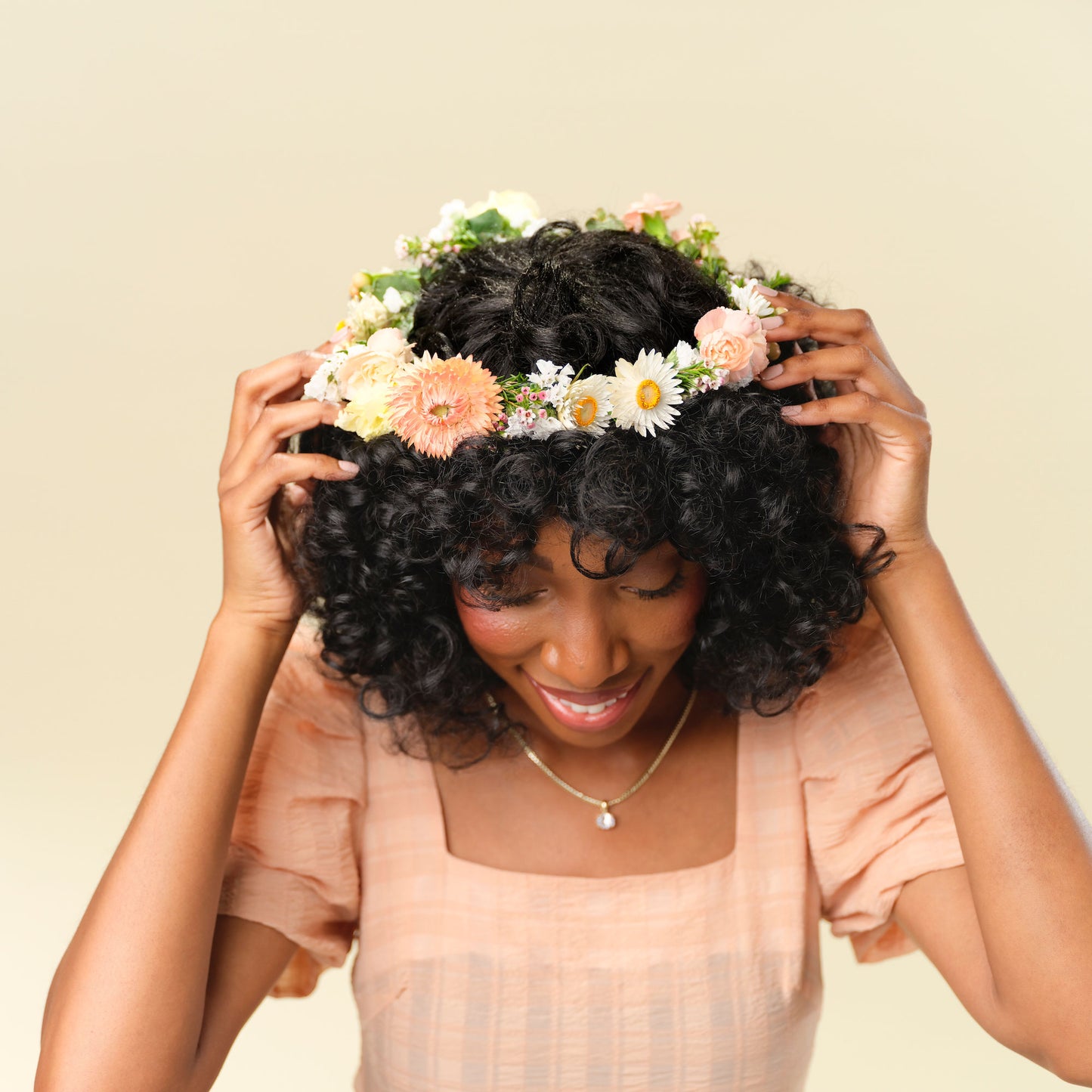 Lucy Flower crown in neutral colors worn by a model