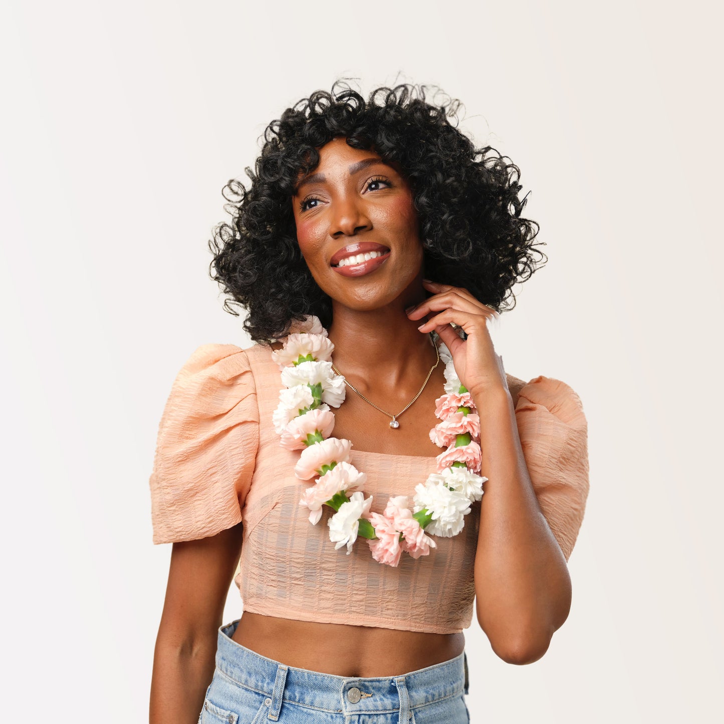 Model wearing a neutral flower necklace from Native Poppy