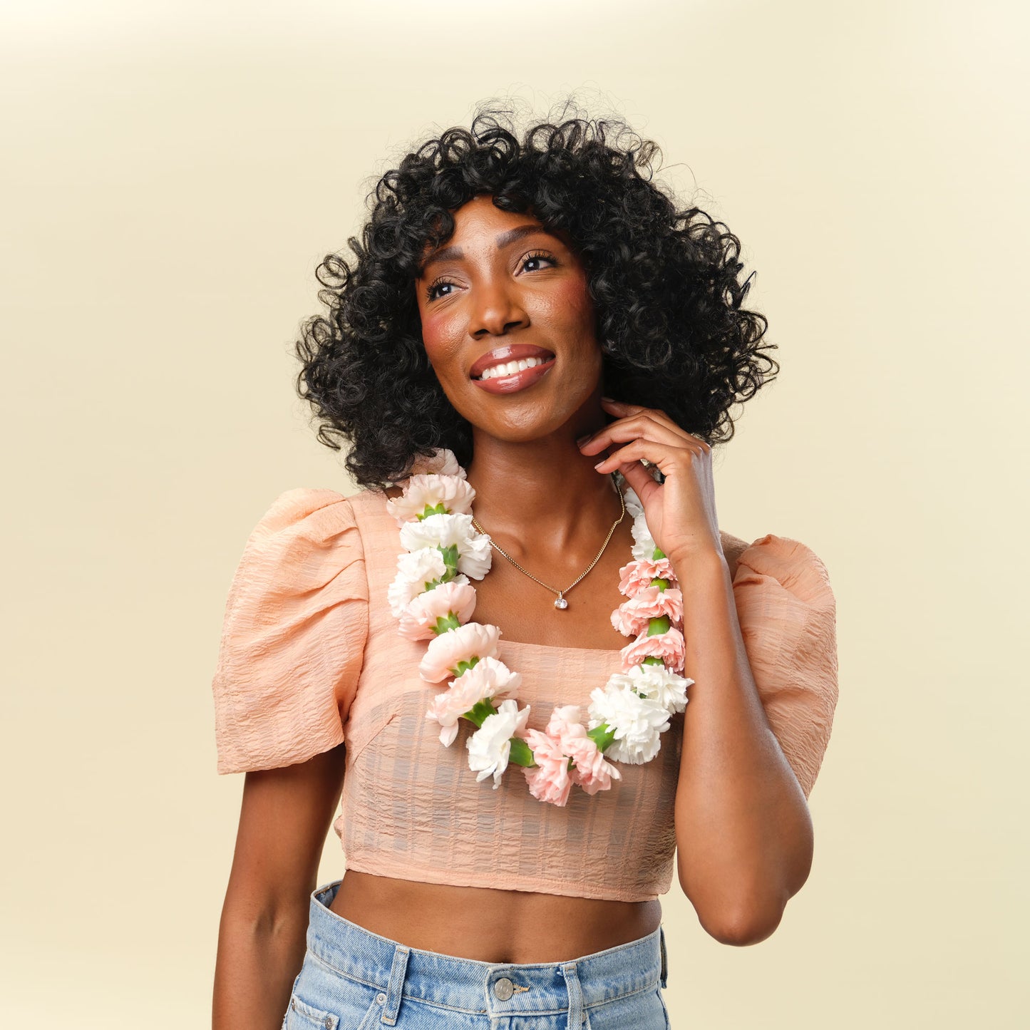 wearing a neutral flower necklace from Native Poppy