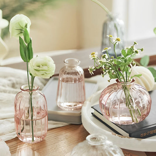 Pink Glass Bud Vases on a table with flowers