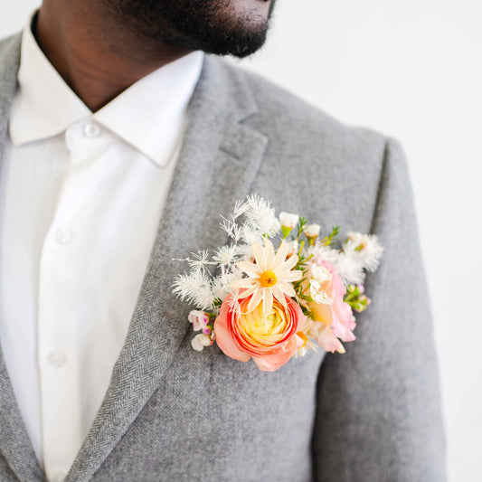 Pocket Boutonnière in a suit jacket pocket worn by a bearded man