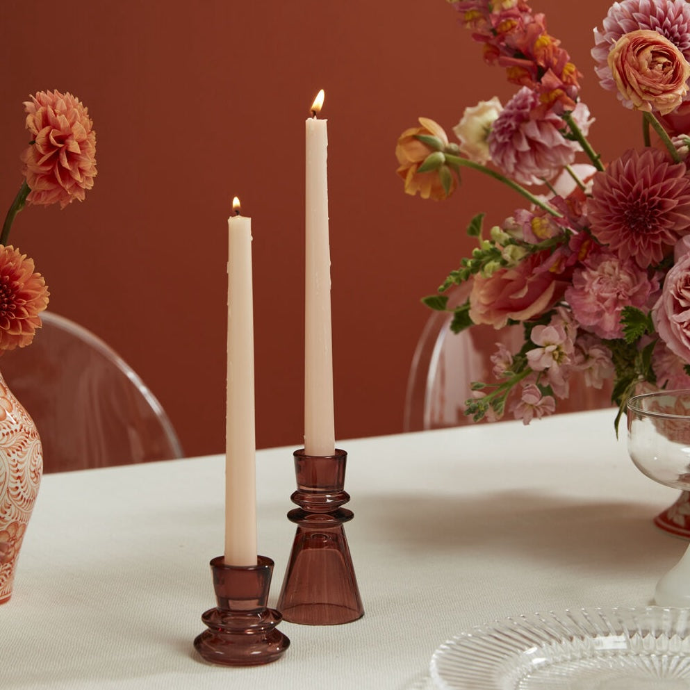 Sumba Candleholder on a table with peach colored flowers