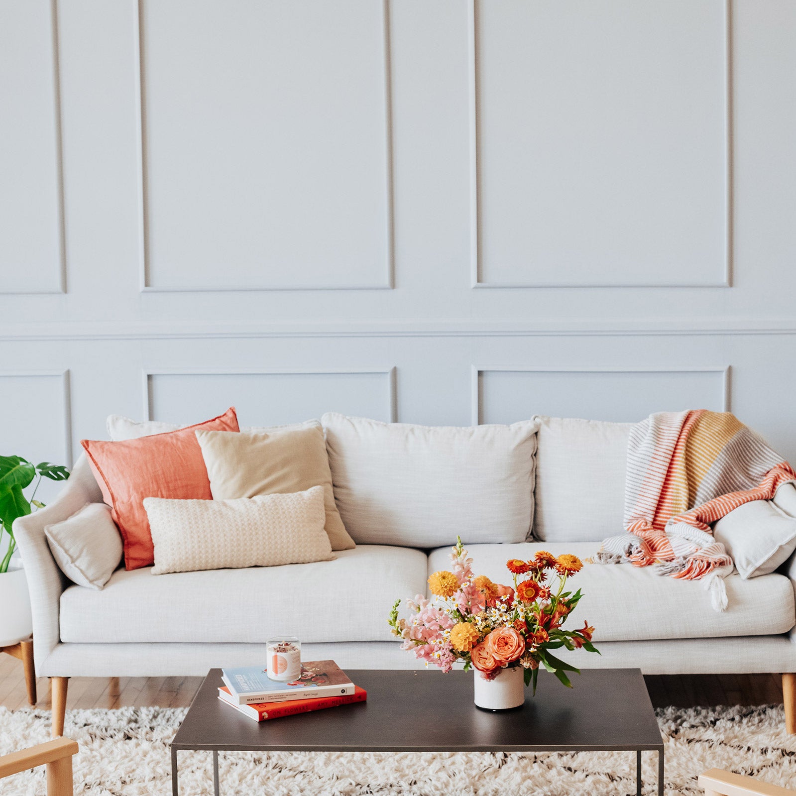 Classic seasonal flower arrangement from Native Poppy in a living room