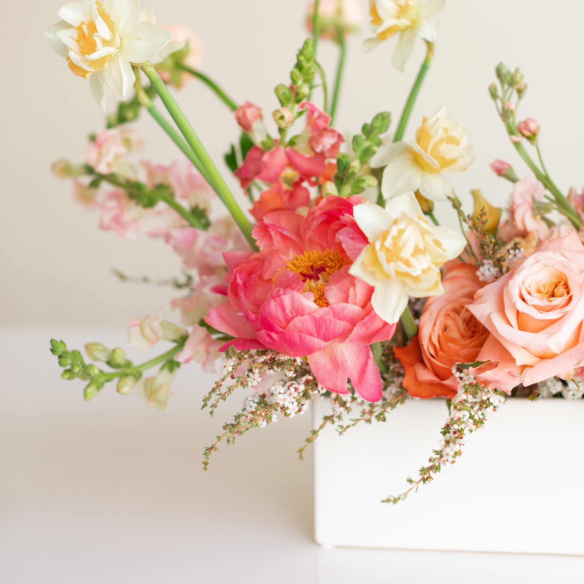 Detail of Long and Low Flower Arrangement with peachy pink flowers