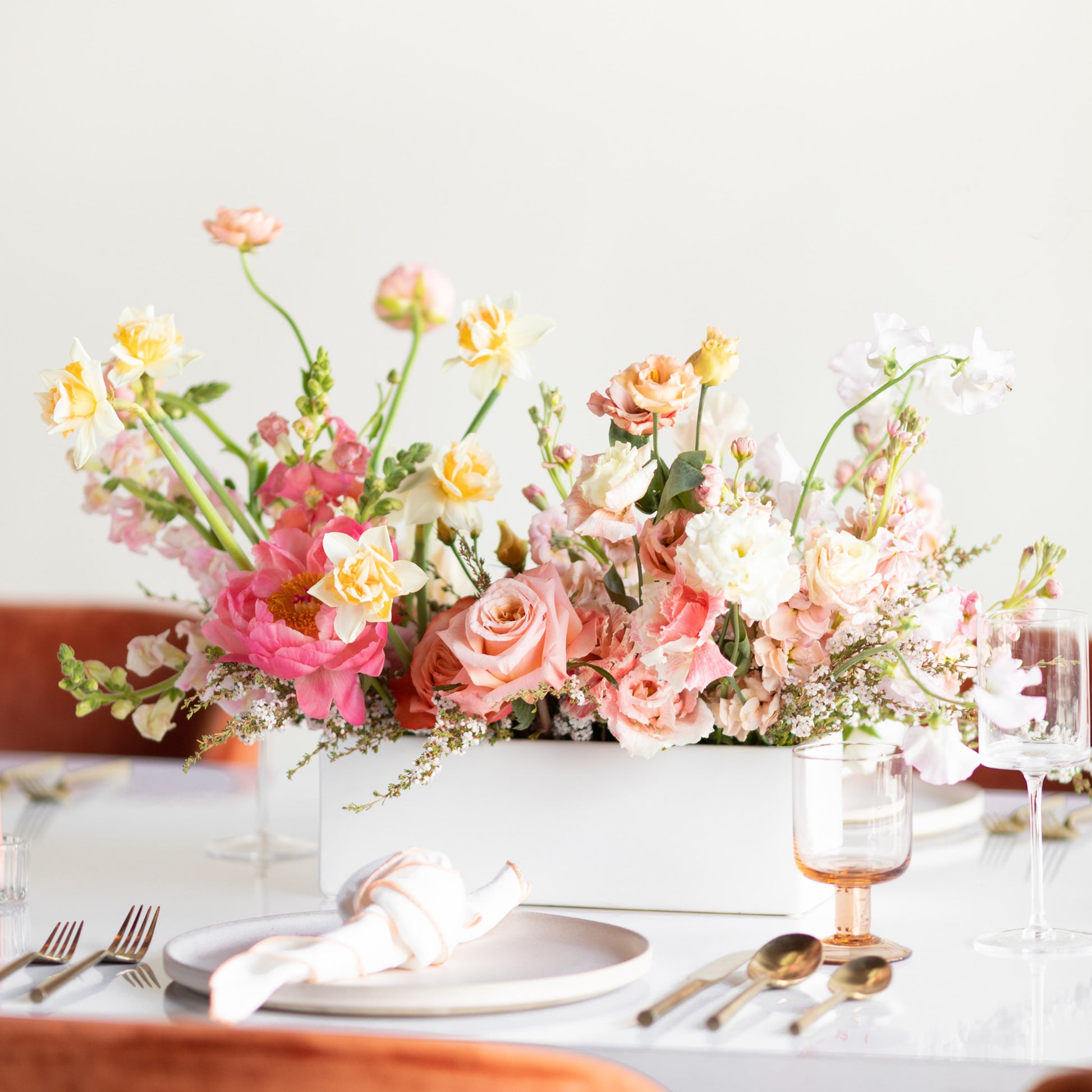 Wide flower centerpiece with formal place setting