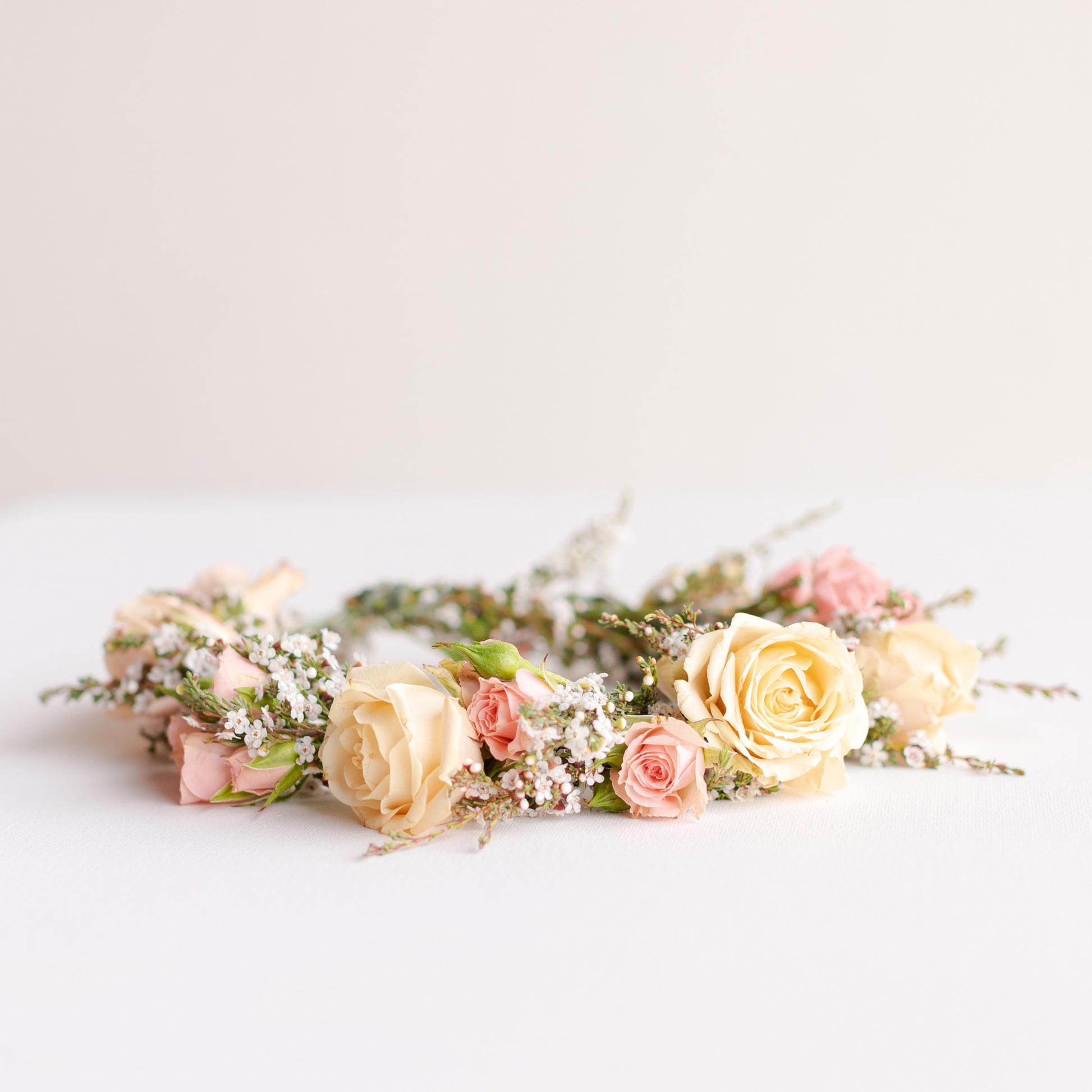 Neutral and pastel yellow and pink flower crown