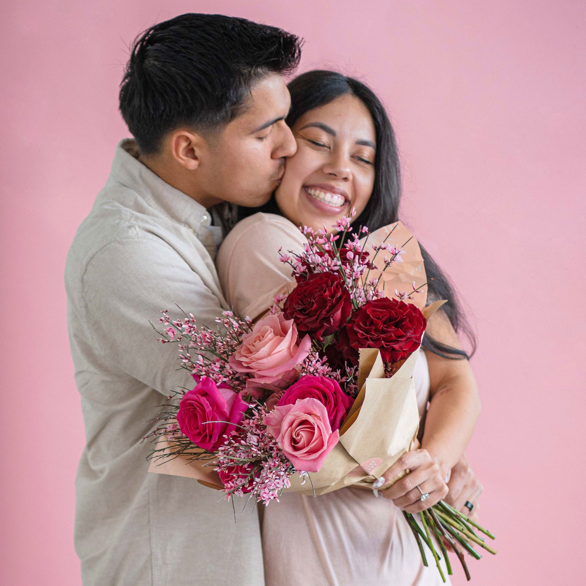 Wild Heart Rose Wrap held by a couple with their arms around each other